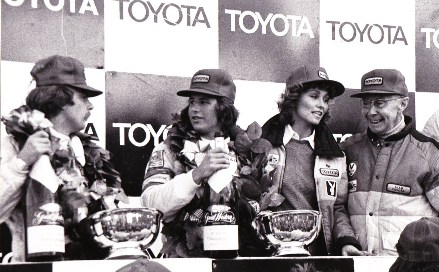 Watkins Glen Toyota Grand Prix 1980: Awarding the trophy to Alan Jones, 1980 Formula One Champion, and 2nd place winner Carlos Reutemann, as racing legend Rene Dreyfus (R) looks on. (Photo courtesy of Toyota Grand Prix)